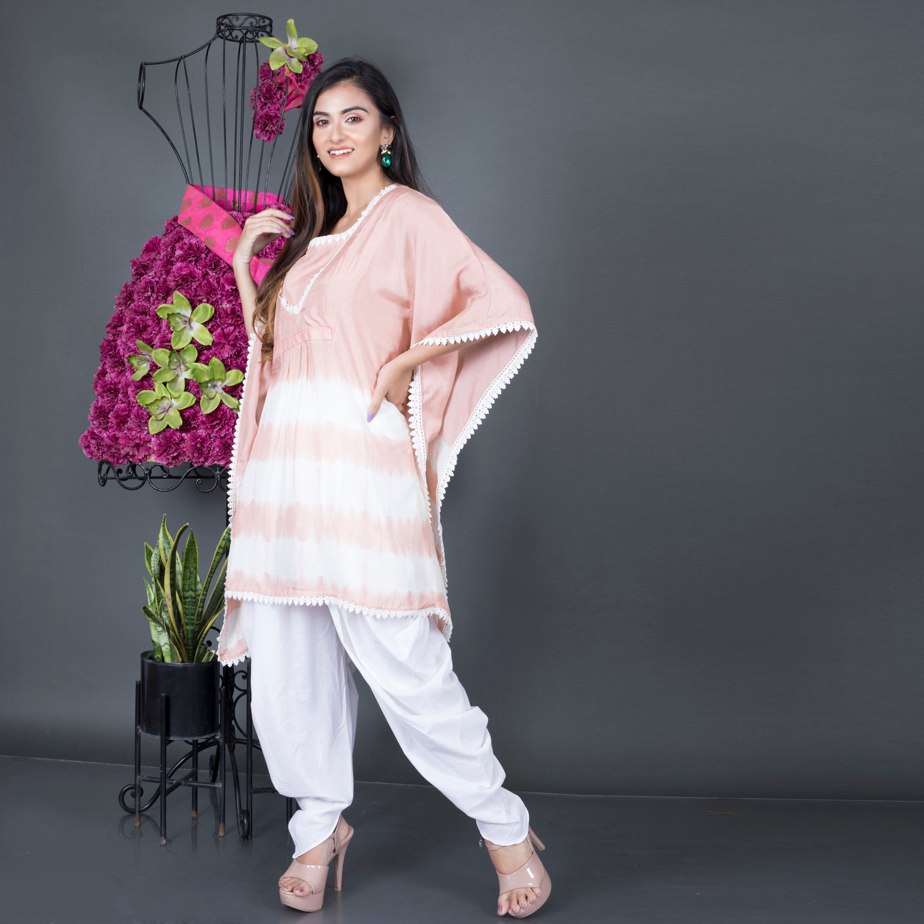 Kaftan kurta paired with dhoti pant