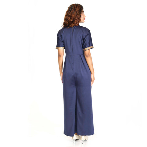 Crepe jumpsuit embellished in gold sequins.